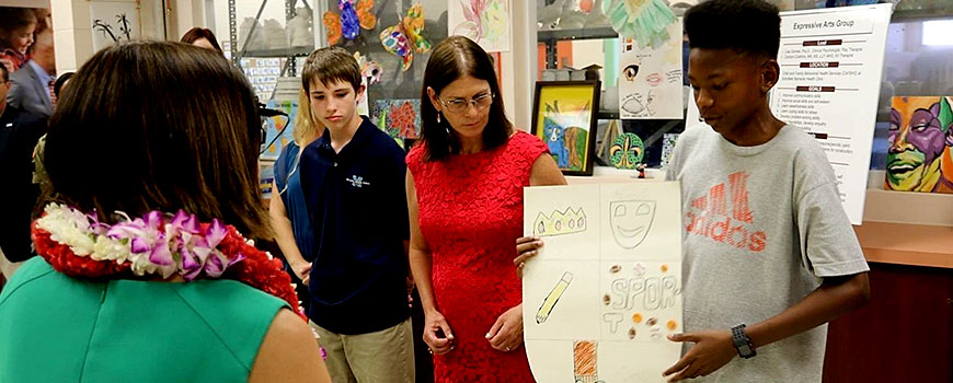 youth presenting in front of his peers